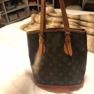 Authentic small Louis Vuitton bag with some wear